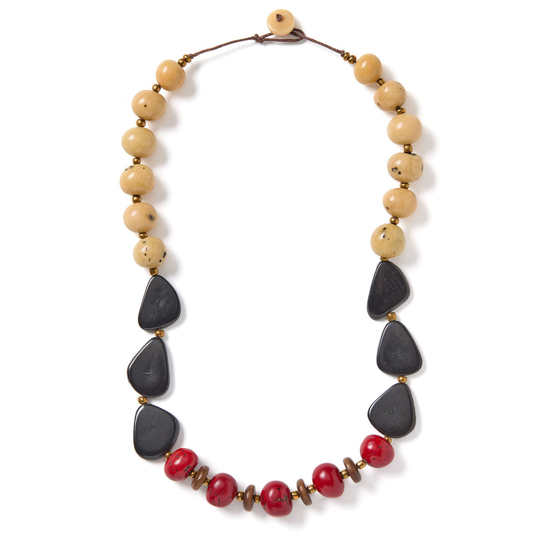 a chucky tagua necklace on a white background