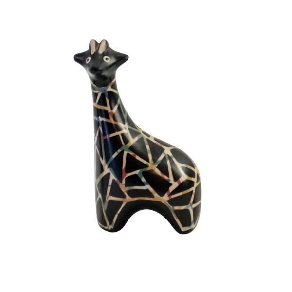 Giraffe-shaped ceramic figurine with geometric pattern on a white background