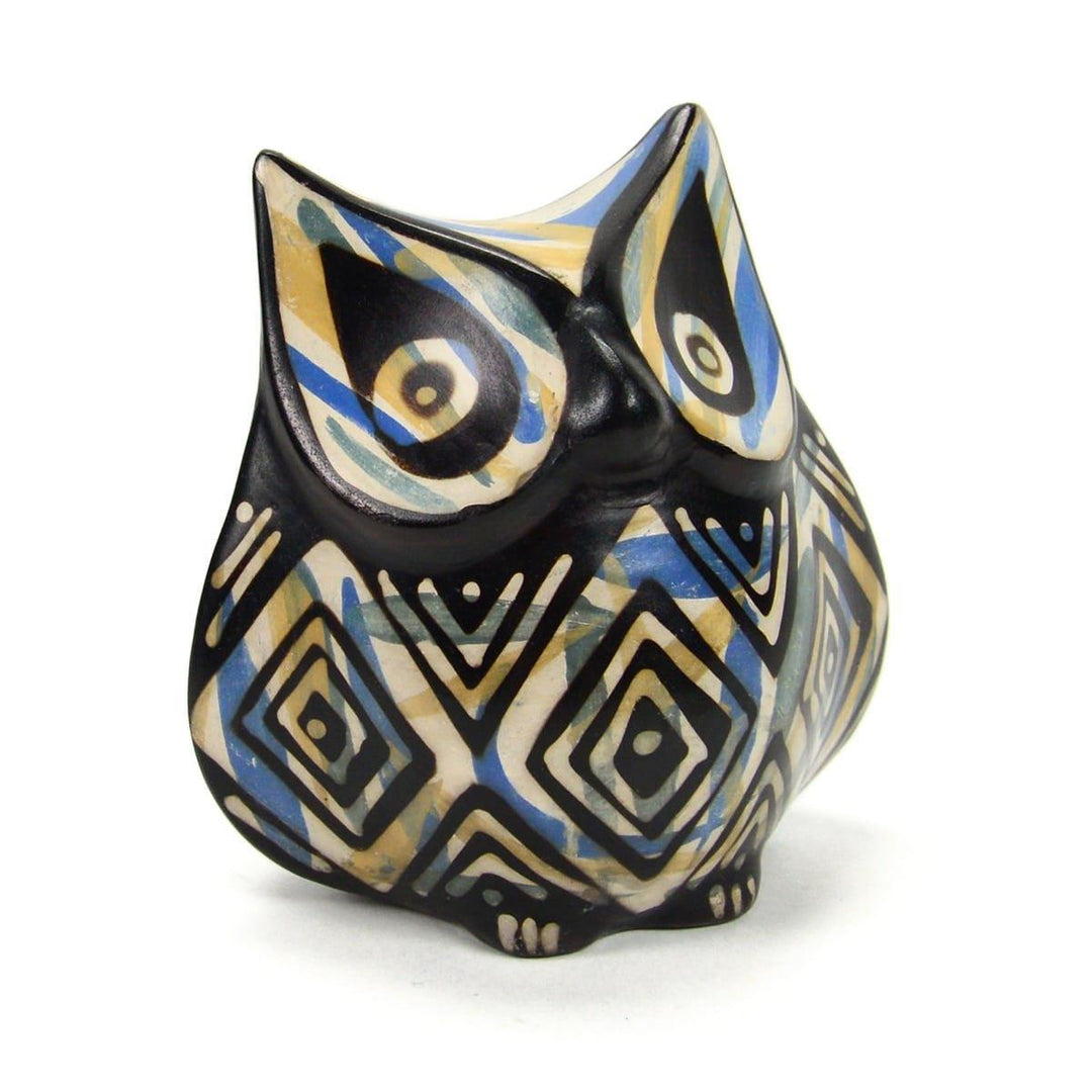 A multicolored ceramic owl sculpture with geometric patterns.