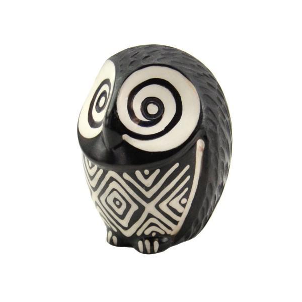 Black and white owl-shaped ceramic sculpture on a white background