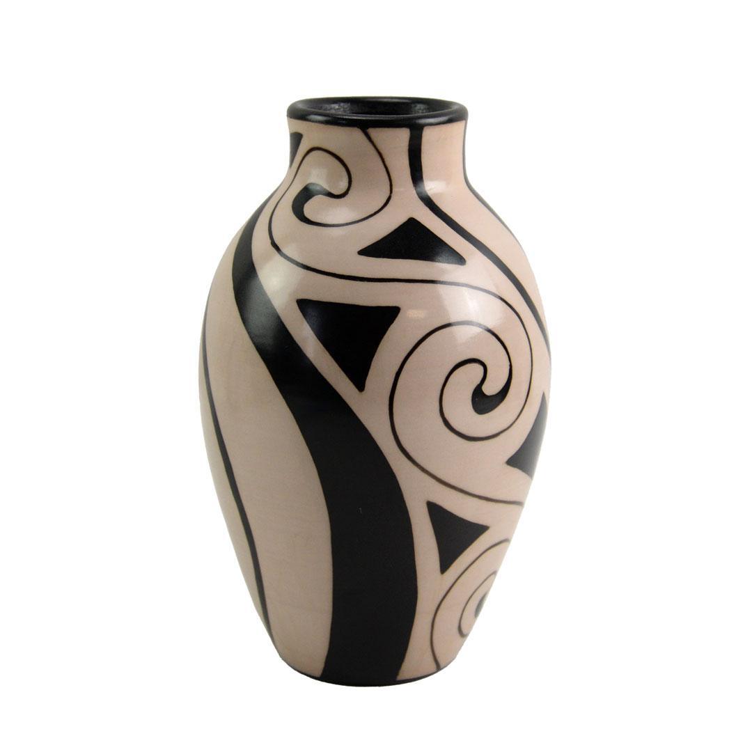 Ceramic vase with black spiral and geometric patterns on a beige background