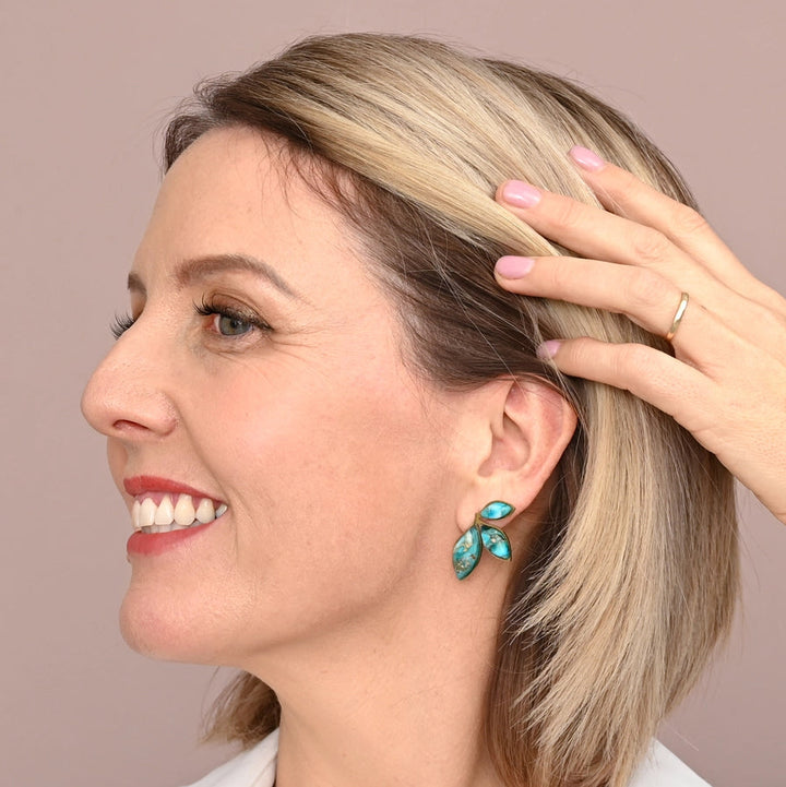 green leaf earring on a model