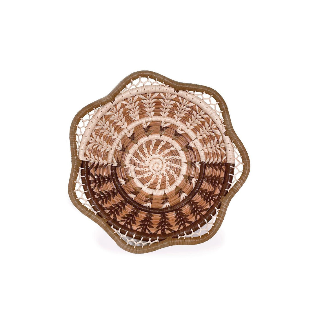 Decorative woven plate with a spiral pattern on a white background