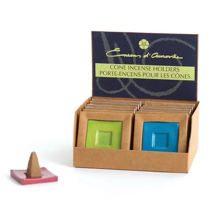 Display of cone incense holders with a branded box on a white background