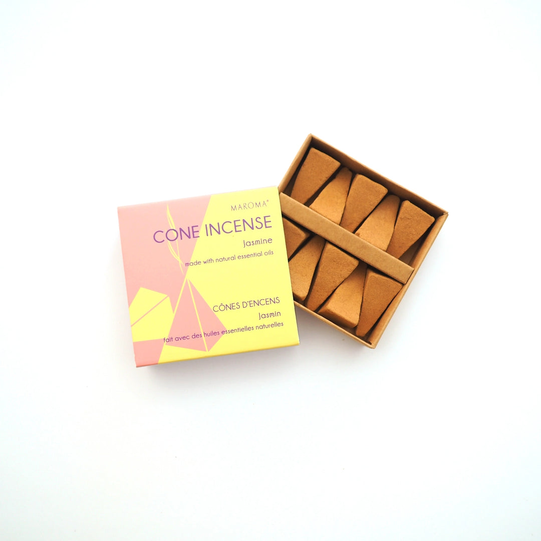 Cone incense packaging with a pink and yellow box and brown cones on a white background