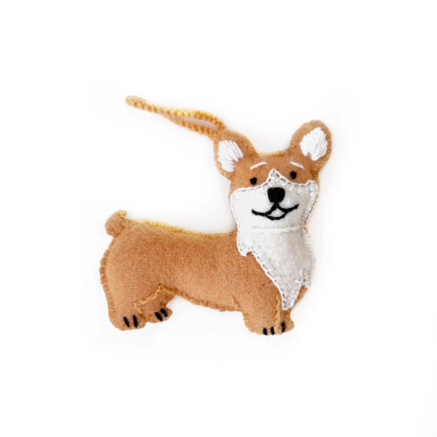 A small corgi felt dog ornament or charm in tan and white with black facial details and a short loop at the top, shown on a plain white background.