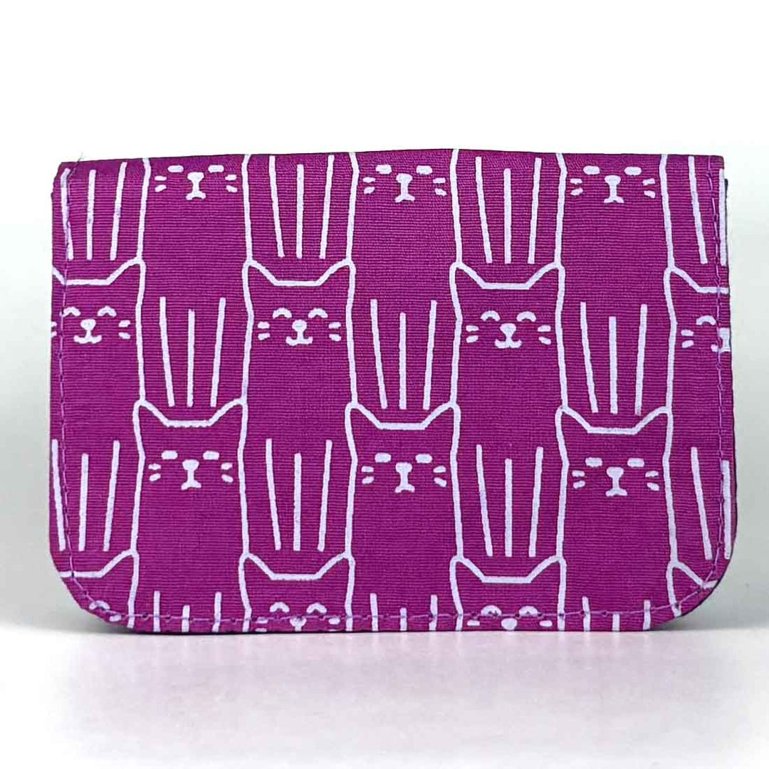 Purple pouch with white cat pattern on a white background