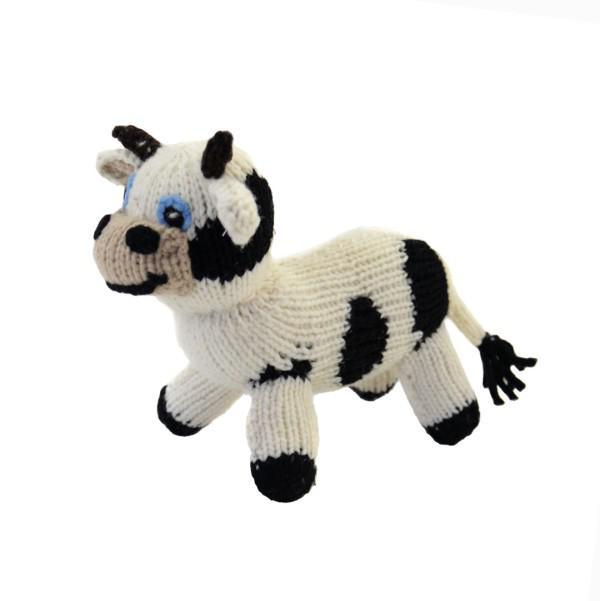 Knitted cow toy on a white background