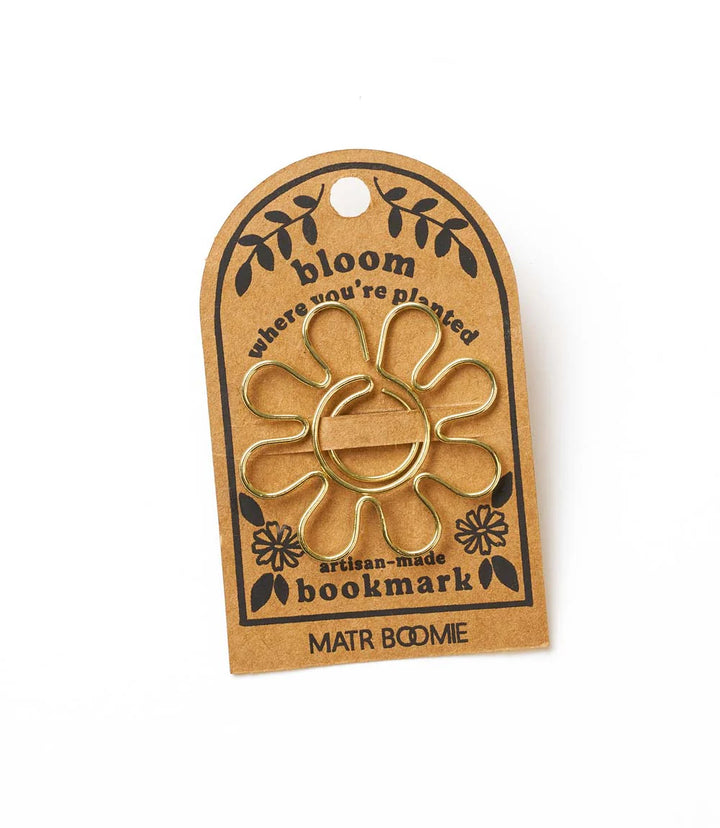 DAISY FLOWER WIRE BOOKMARK ON a brown 