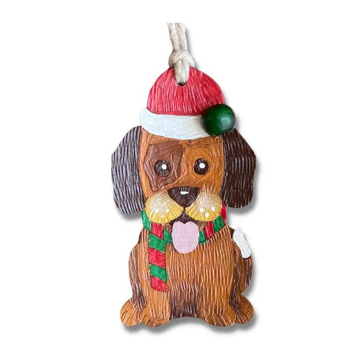 Hand painted Christmas ornament of a dog wearing a scarf and Santa hat.