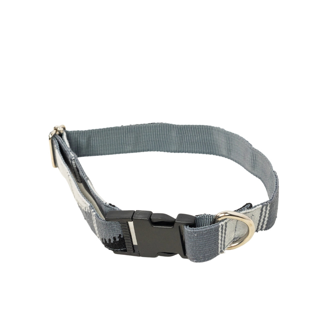 Gray dog collar with a black buckle on a white background
