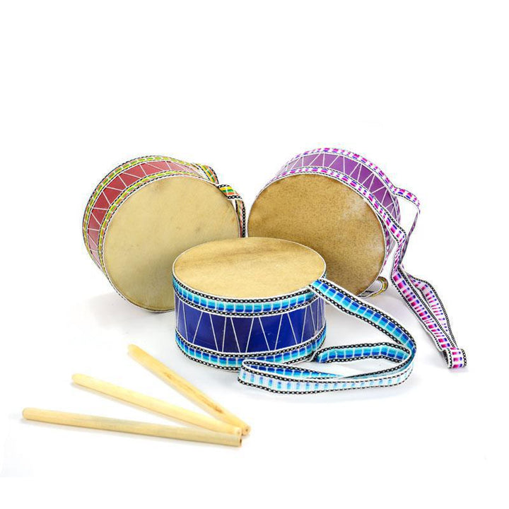 Set of colorful drums with drumsticks on a white background