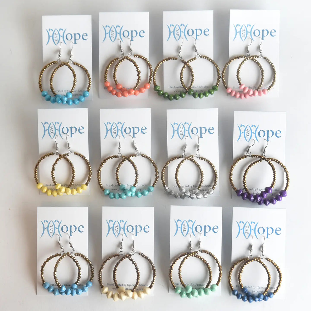 Set of hoop earrings with colorful beads on 'FE Hope' branded cards.