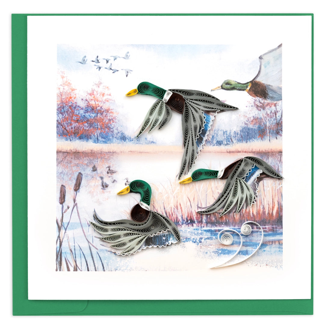 Quilled card with ducks flying over a water scene