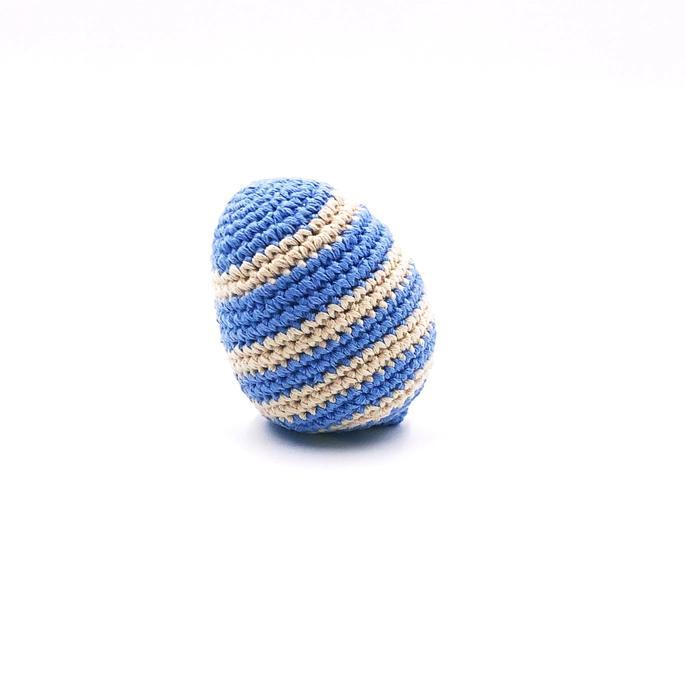 A handcrafted blue striped crocheted Easter egg baby toy made from organic cotton yarn.