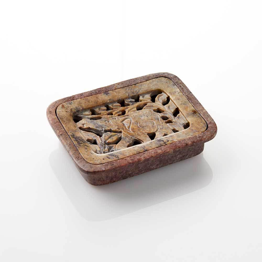 Hand-carved natural gorara stone elephant soap dish with intricate details on an elephant design, showing signs of wear and craftsmanship.