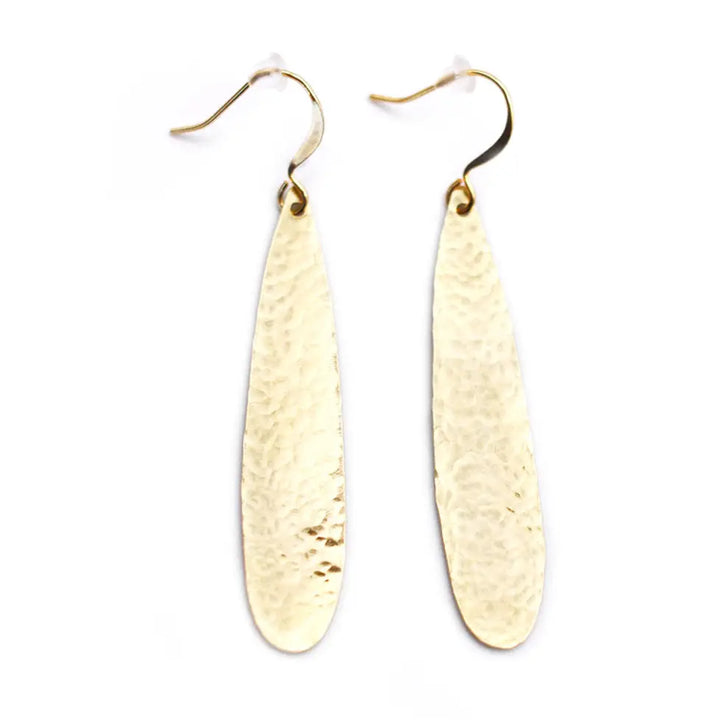 A pair of hammered gold dangle earrings with teardrop-shaped drops and fishhook wires, shown on a plain white background.