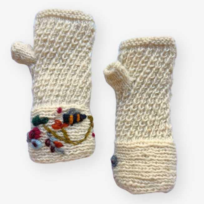 Pair of knitted fingerless gloves with colorful designs on a white background