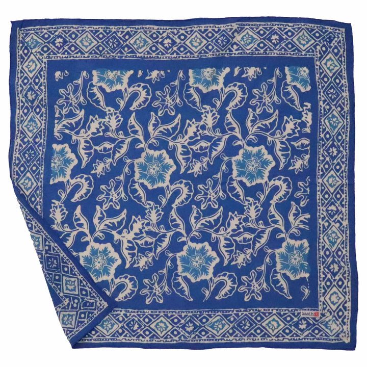 Blue floral patterned bandana with white border on a white background
