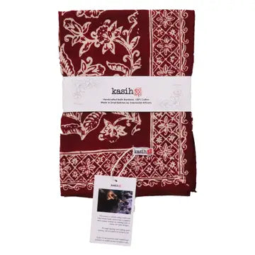Red and white patterned fabric with 'kasih' branding on a white background