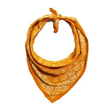 Orange bandana with white patterns on a white background