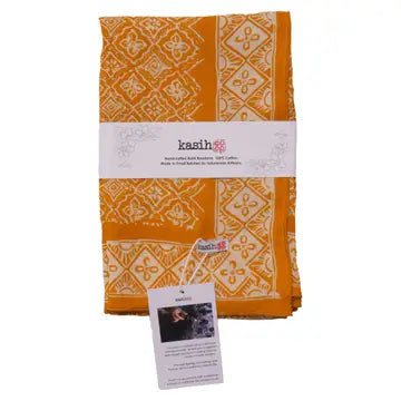Orange and white patterned fabric with 'kasih' branding on a white background