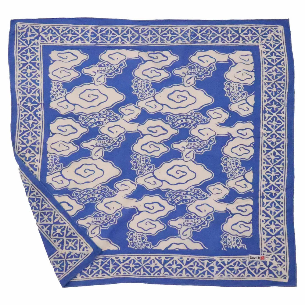 Blue bandana with white geometric pattern on a white background