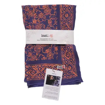 folded patterned bandana with a Kasih tag on a white background