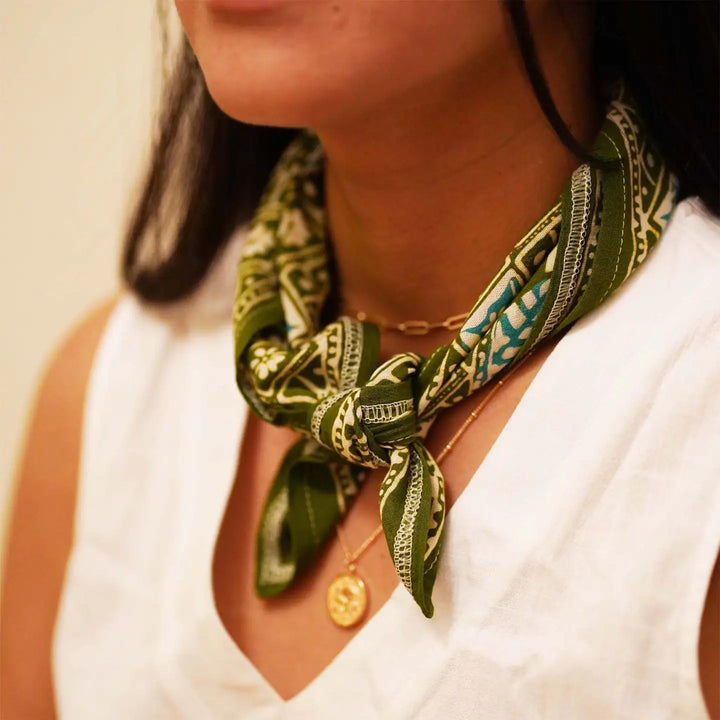 Women wearing a green bandana. 