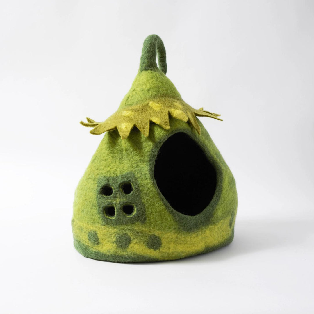 Green felted fairly pet house with a pointed roof on a white background