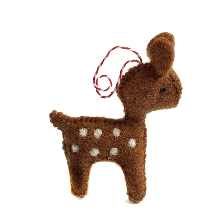 A brown felt reindeer ornament with white spots and a red-and-white hanging string, shown on a plain white background.
