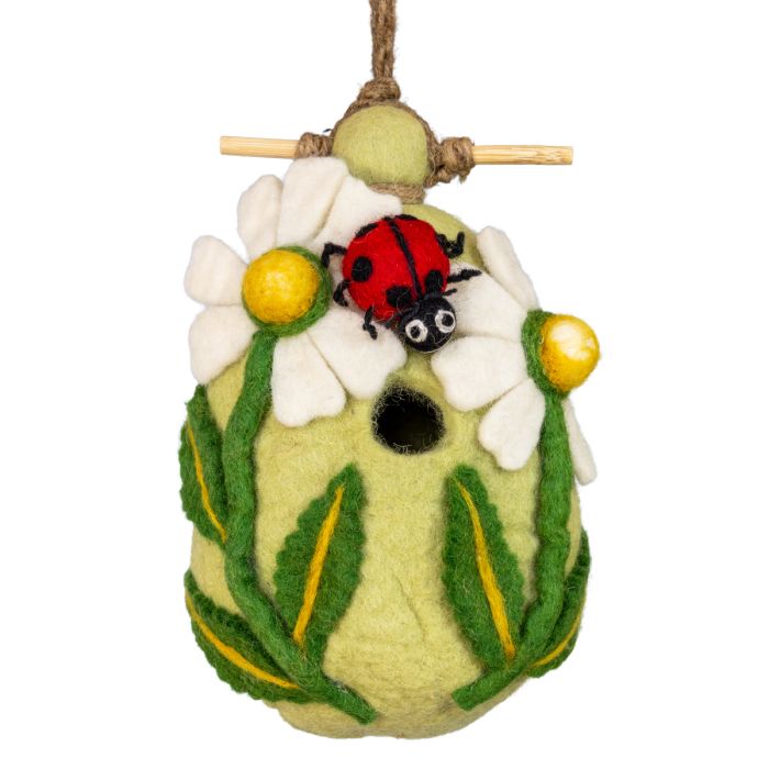 Felted birdhouse with a ladybug and flowers on a white background