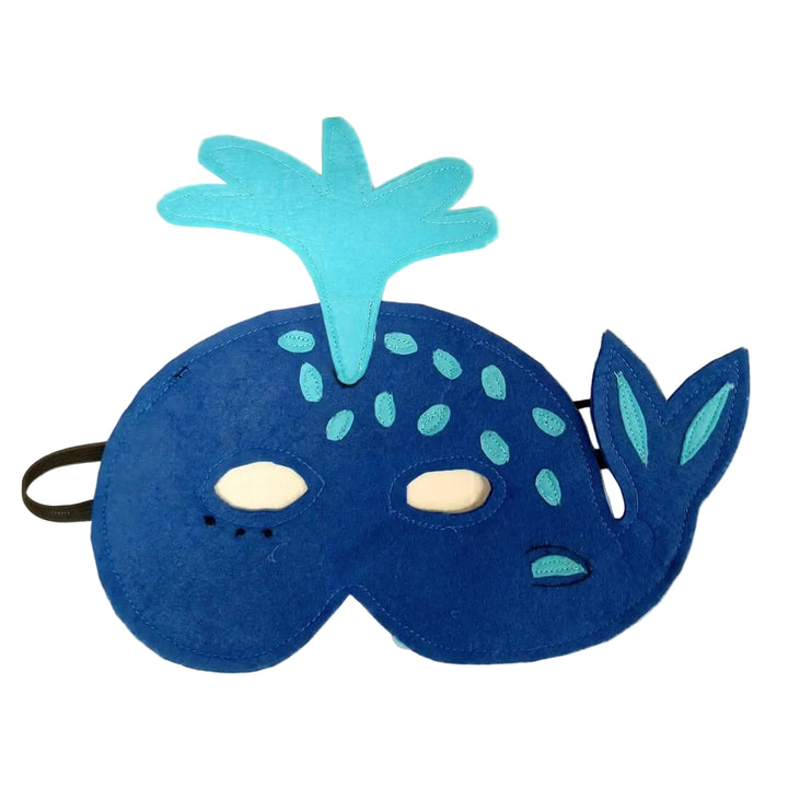 Blue mask with whale design on a beige background