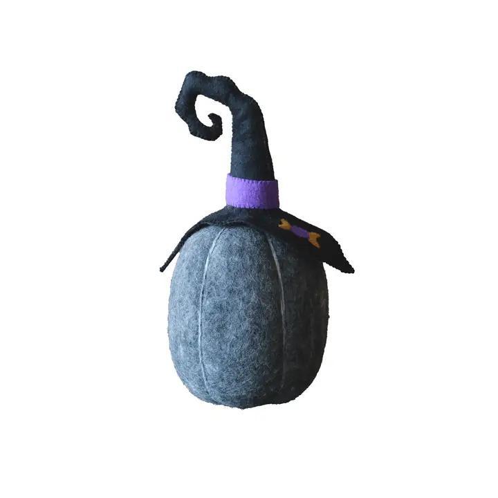 Handmade black felt pumpkin wearing a witch's hat.