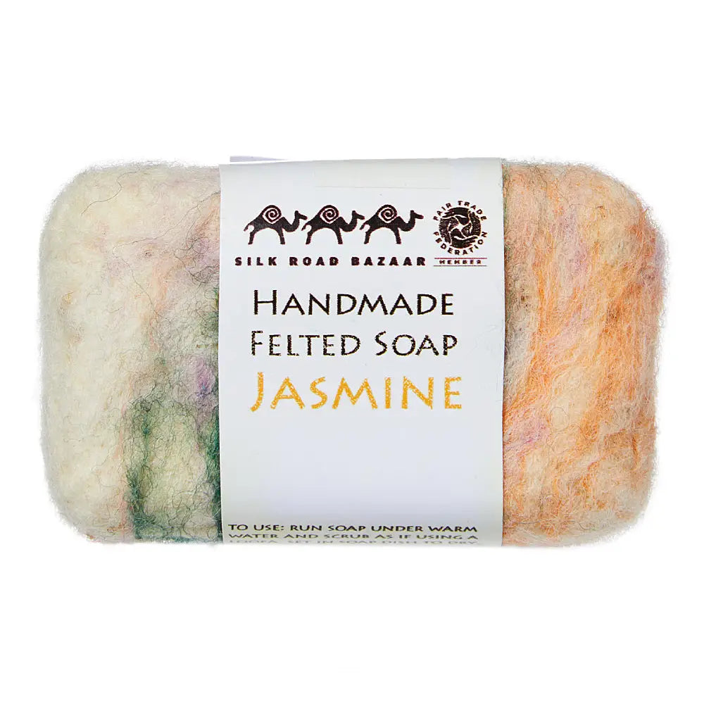 Handmade felted soap with a label on a white background