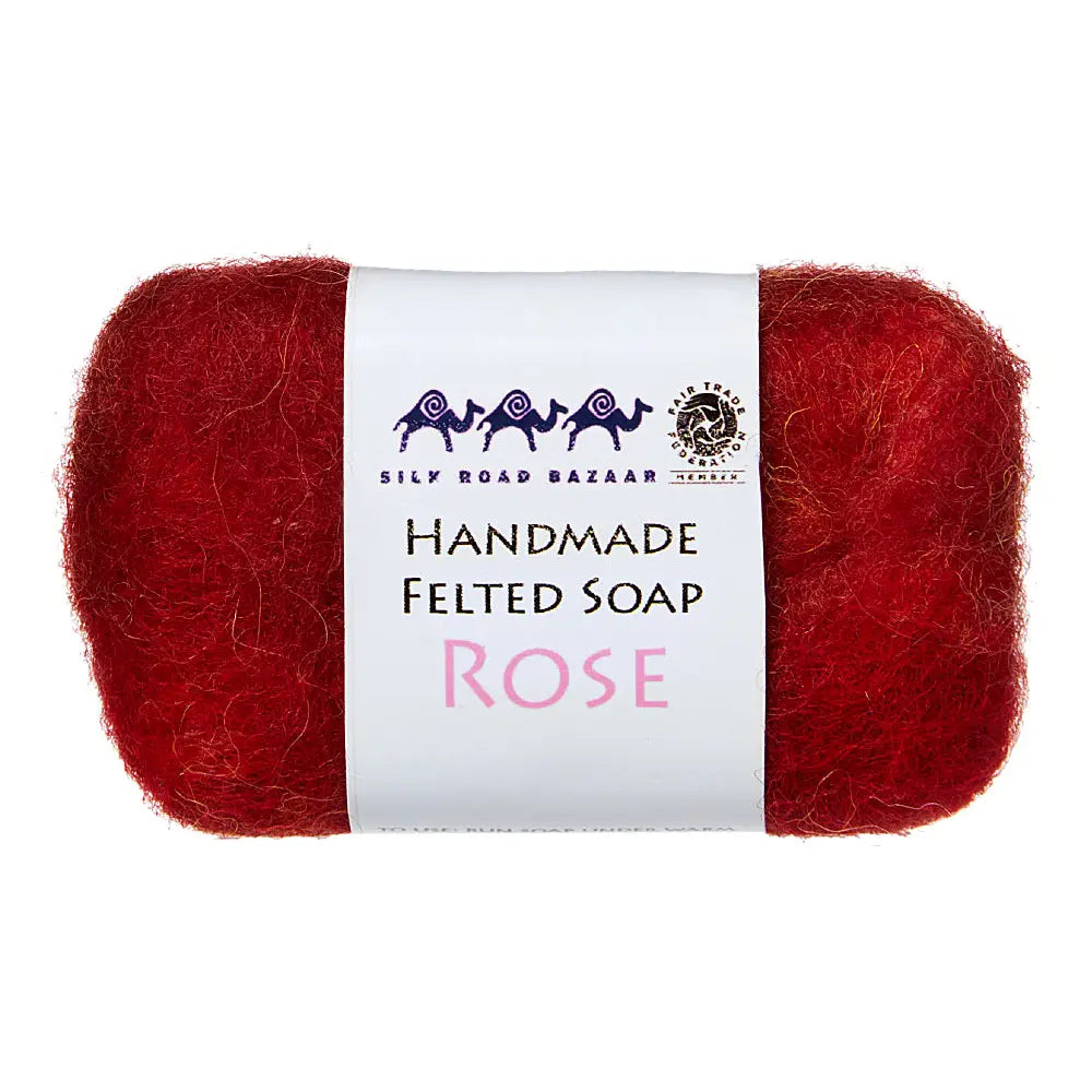 Red handmade felted soap with a white label on a white background
