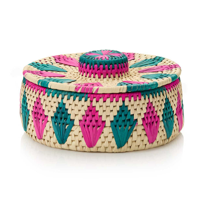 Woven basket with pink and green patterns on a white background
