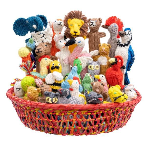 A basket filled with various hand-knitted finger puppets in different colors and designs, including animals and people.