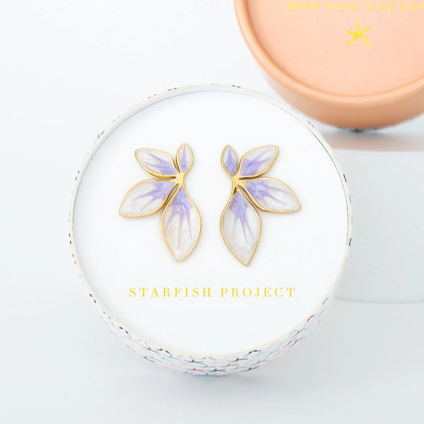 Floral earrings in a Starfish Project box on a light gray background
