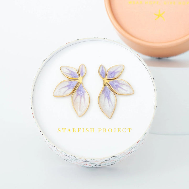 Floral earrings in a Starfish Project box on a light gray background