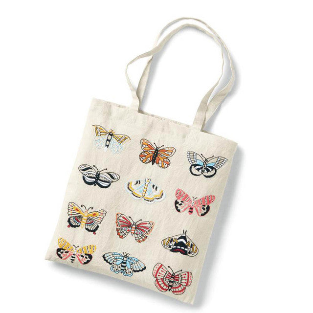Tote bag with colorful butterfly designs on a white background