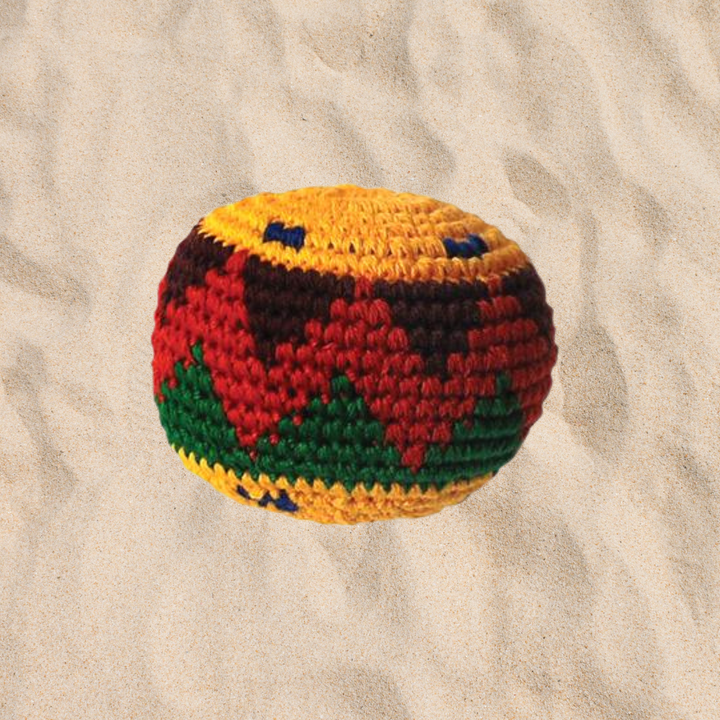 a hacky sack in the sand