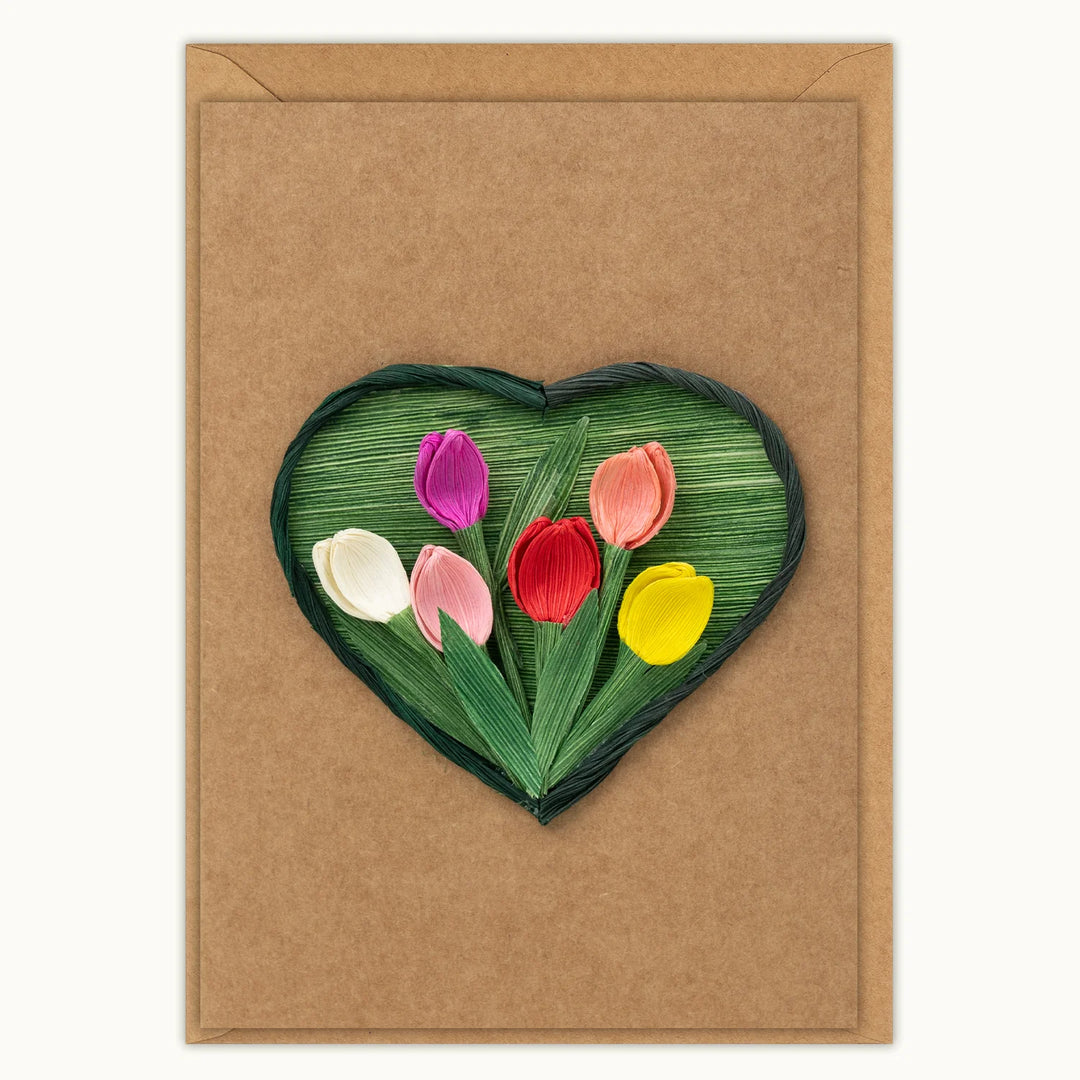 Heart-shaped card with colorful tulips on a brown background