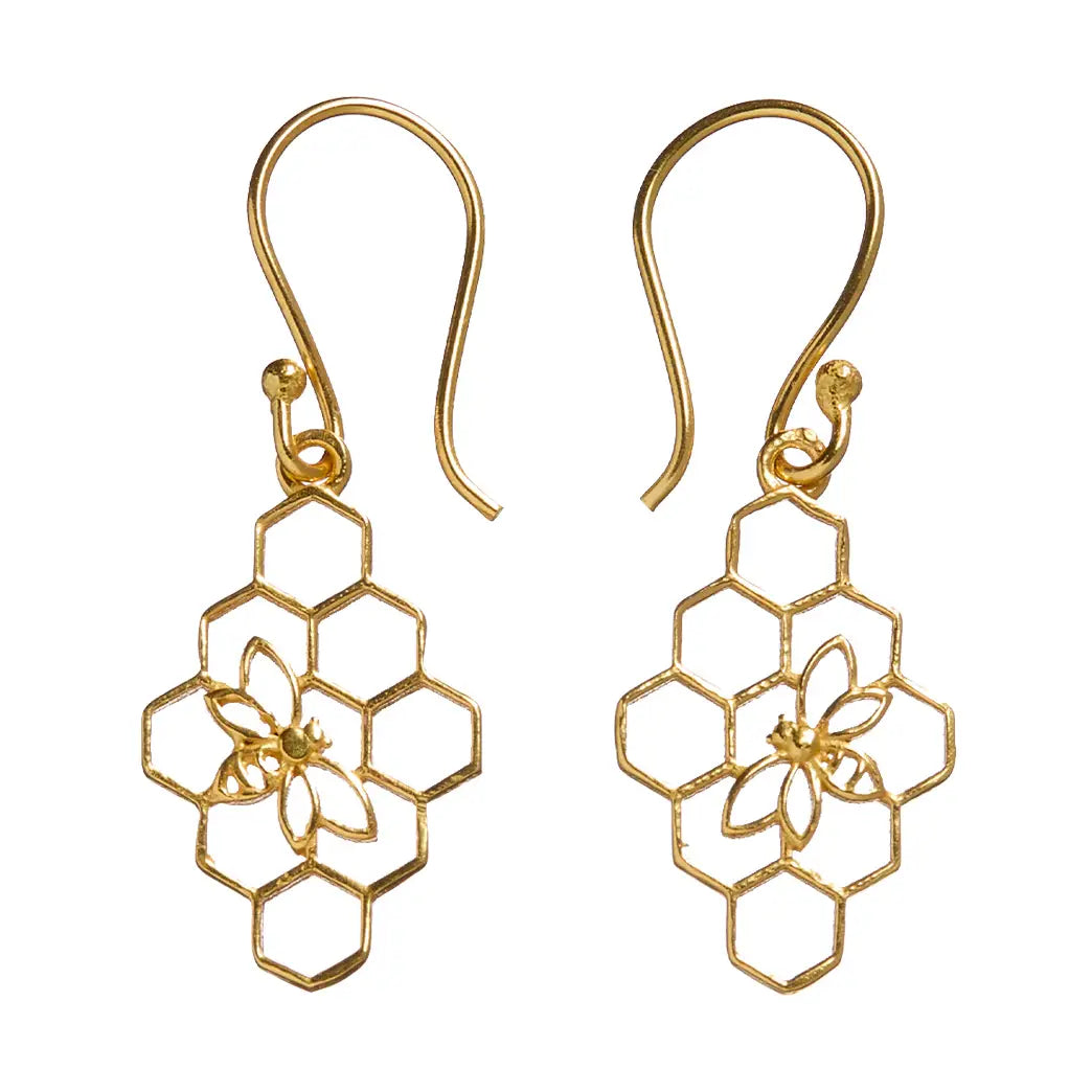 Gold honeycomb and bee design earrings on a white background