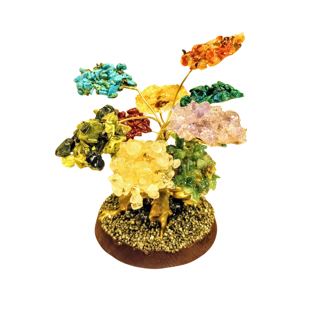 A decorative stone tree with different stones on a circular base