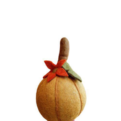 A handcrafted felt harvest pumpkin with a gold, brown, and orange color scheme, featuring a stitched stem and a floral pattern on top.