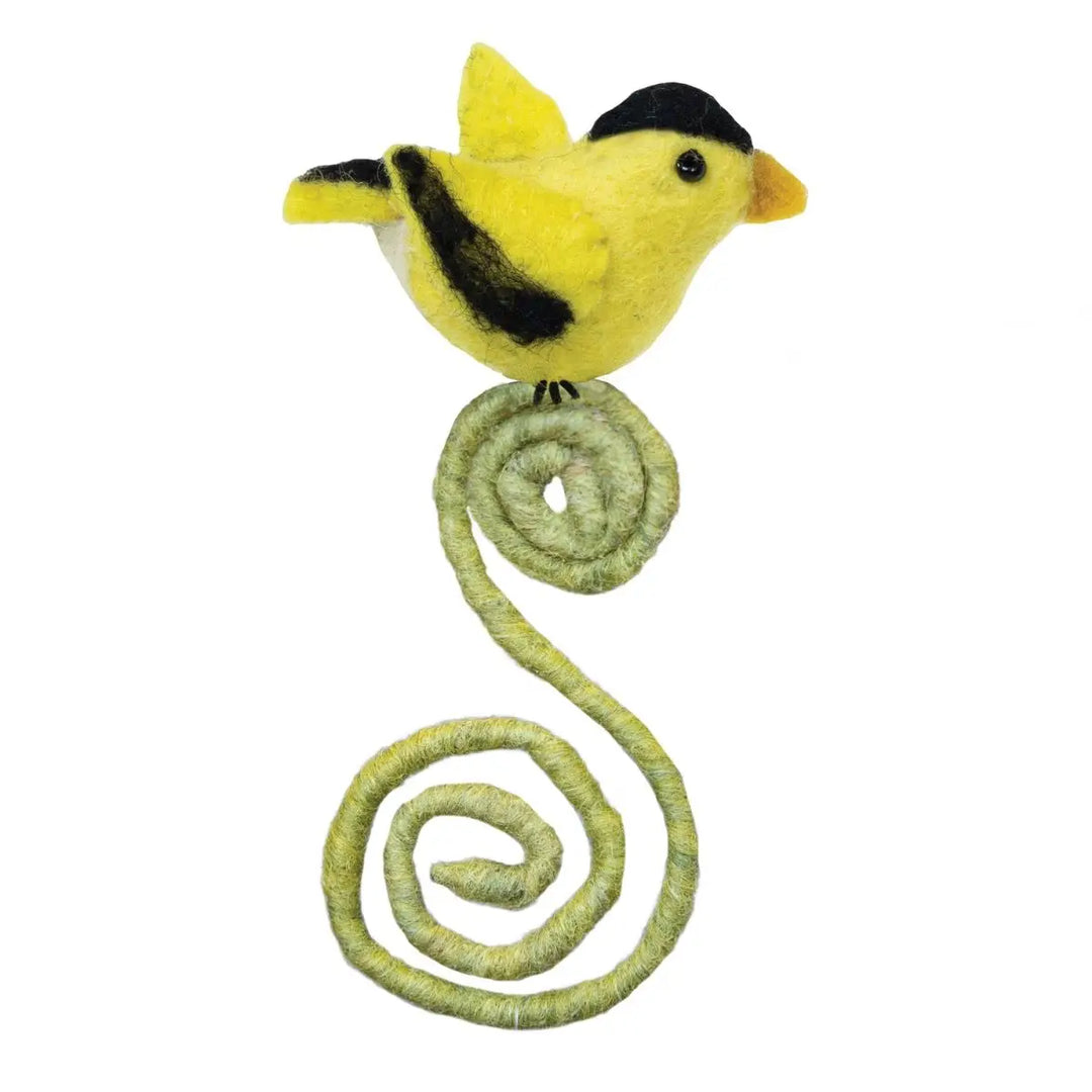 Yellow bird plush  on a green spiral wire against a white background