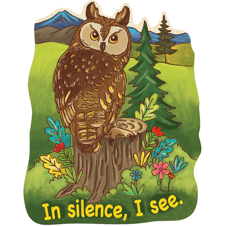 A die-cut sticker  a brown owl perched on a tree stump in a grassy landscape with mountains, trees, flowers, and the text 'In silence, I see.' at the bottom.