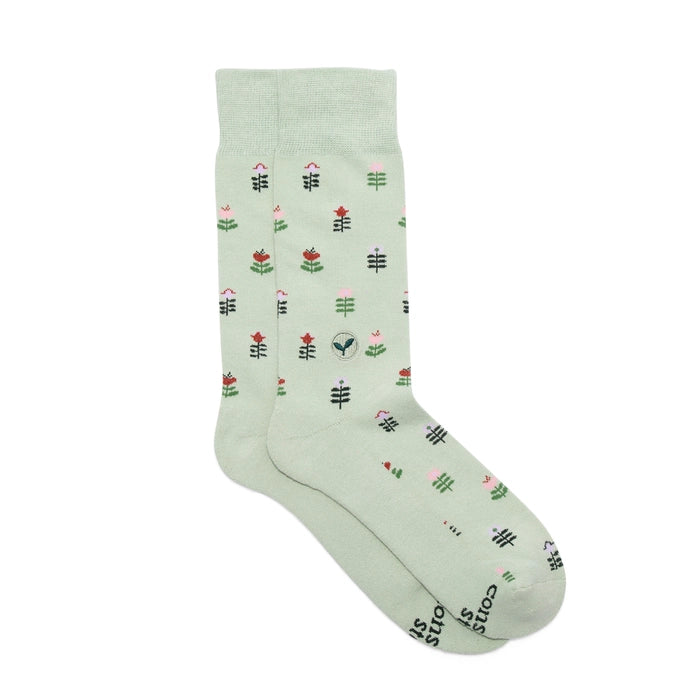Conscious Step green crew socks with tulips on a white background