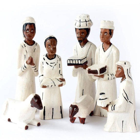 Set of wooden nativity figures on a white background